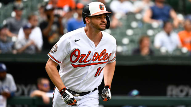 Orioles designated hitter Trey Mancini watches his inside the park home run hit in the eighth inning of a game against the Rays.